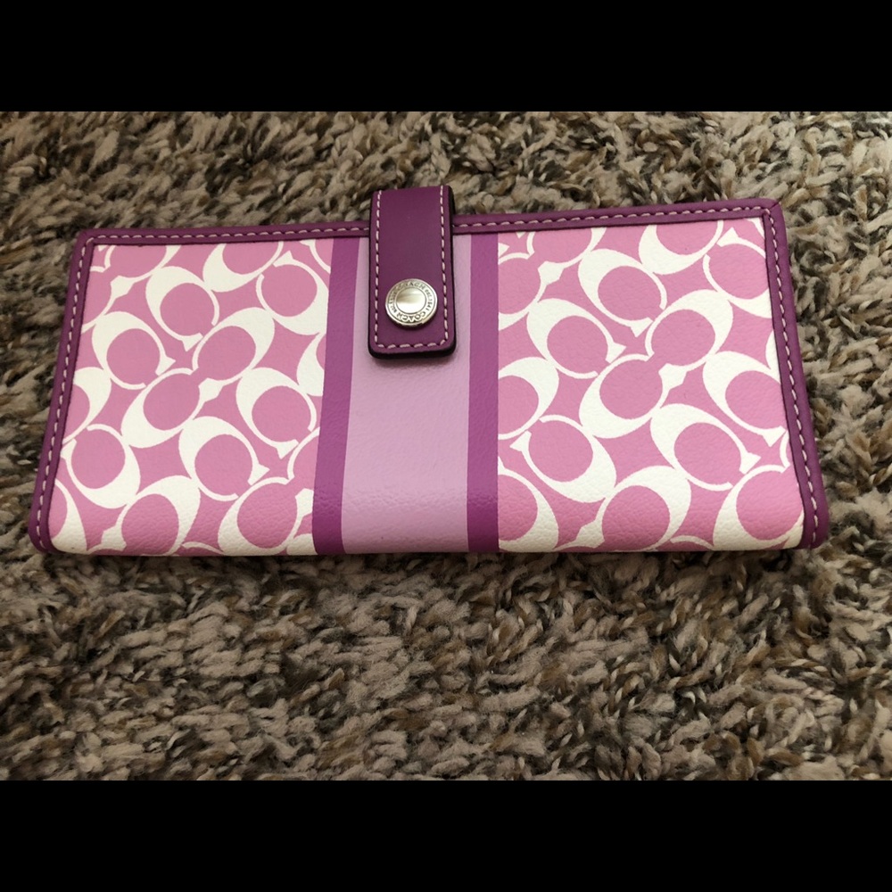 Bright pink Coach wallet with white C’s